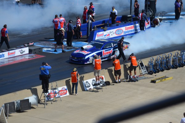 summit racing pro stock camaro doing a burnout at track