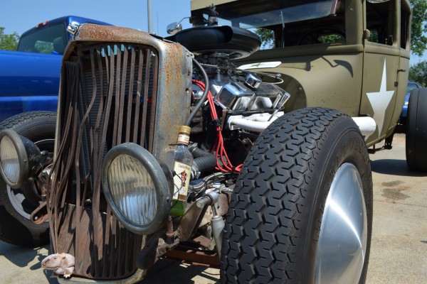 front quarter shot of a military themed ford rat rod tudor coupe