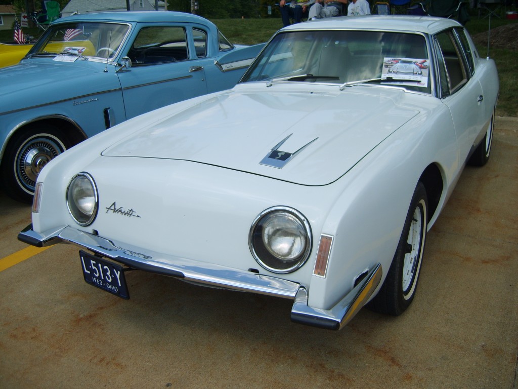 White 1963 Studebaker Avanti Coupe at Summit Racing Car Show