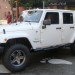 White Jeep Wrangler Unlimited Sahara thumbnail