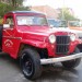 Vintage red Jeep truck thumbnail
