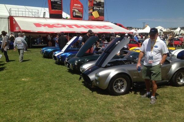 row of shelby cobras at Monterey Car Week, 2012
