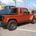Orange Jeep truck thumbnail