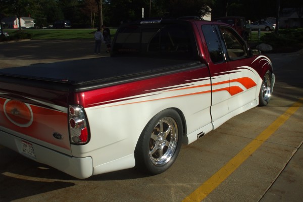 rear quarter view of a customized ford f150 sport truck
