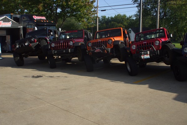 row of jeeps showing articulation at show