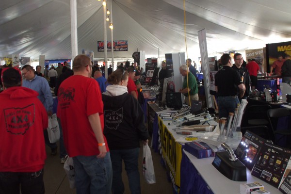 crowd in tent at automotive trade show