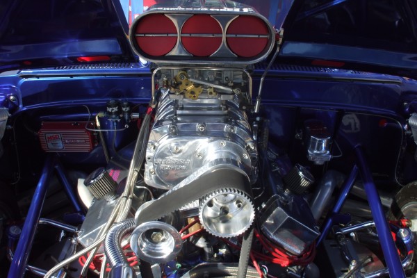 close up of butterfly valves on supercharger scoop in an engine bay