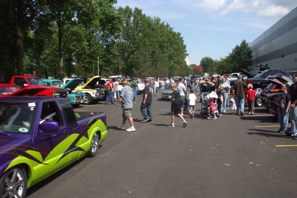 crowds milling about at a car show