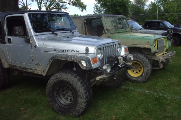 muddy jeeps at a car show