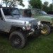 muddy jeeps at a car show thumbnail
