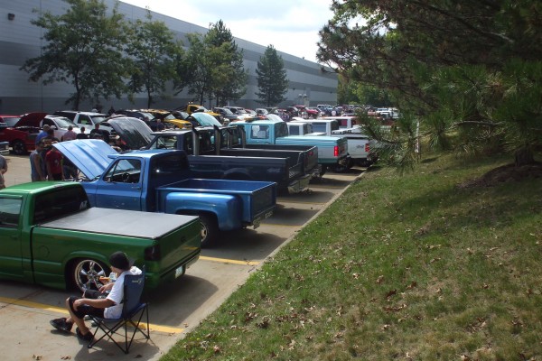 row of vintage trucks at a classic car show