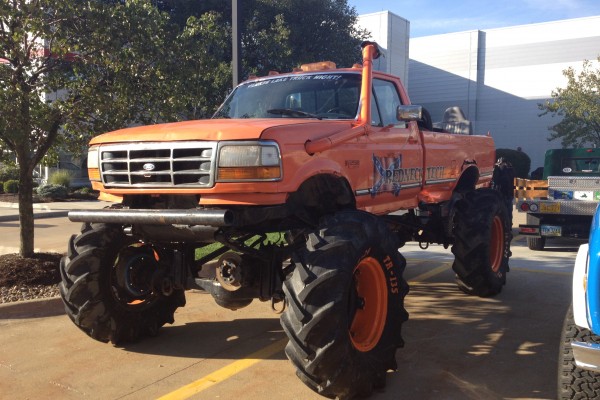 lifted orange ford monster truck