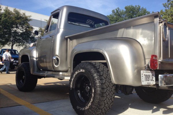 rear quarter shot of a silver hot rod ford truck