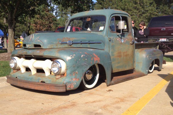 vintage patina'd hot rod ford truck with pinstripes