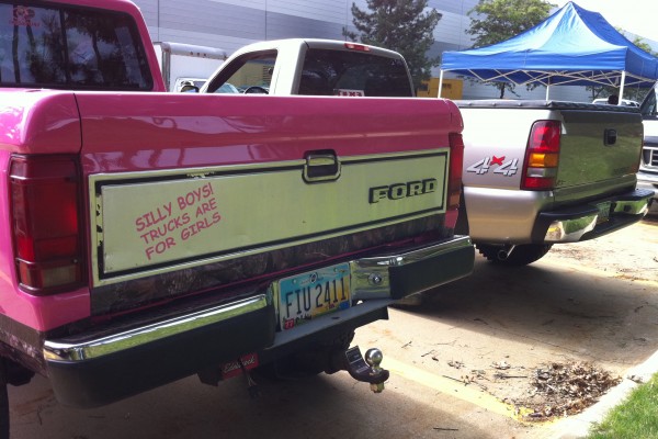 rear tailgates of a pair of trucks