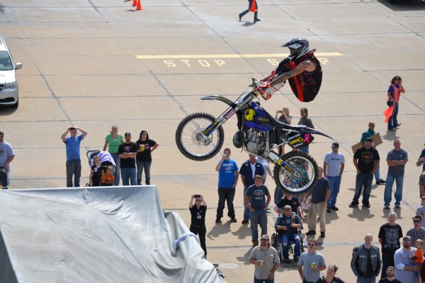 motocross rider doing stunt show during dirt bike exhibition