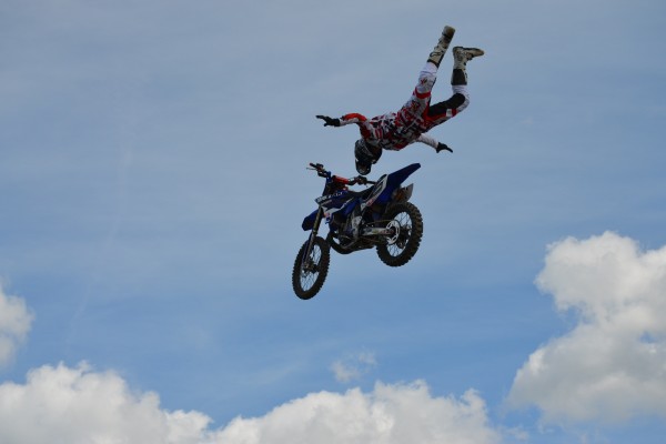 motocross rider doing aerial stunts during dirt bike exhibition