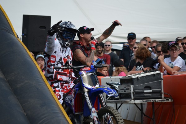 motocross rider greeting crowd during dirt bike exhibition