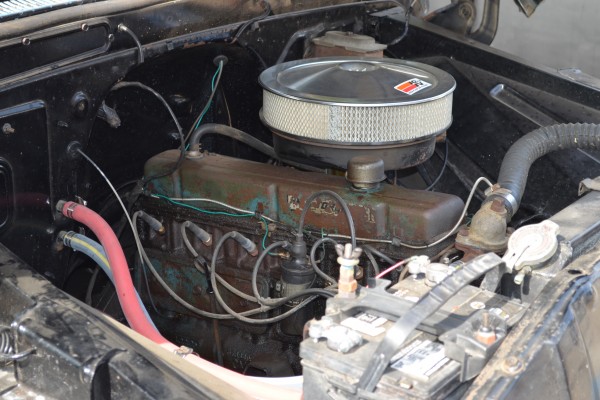 chevy inline six engine in a vintage pickup truck