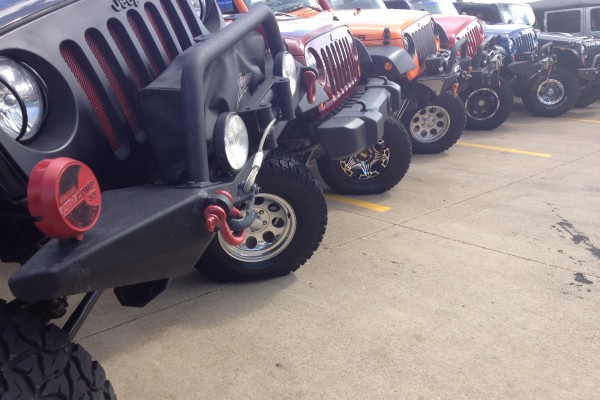 row of wrangler jk jeeps flexing articulation
