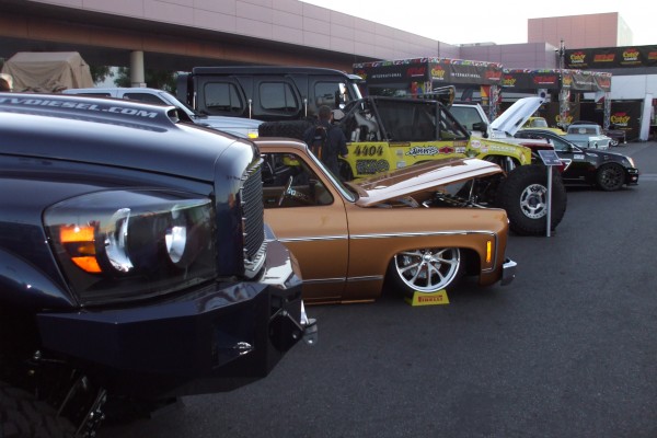 row of classic cars on display at SEMA 2012
