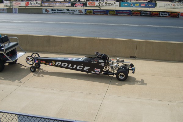 jr dragster being towed to pits