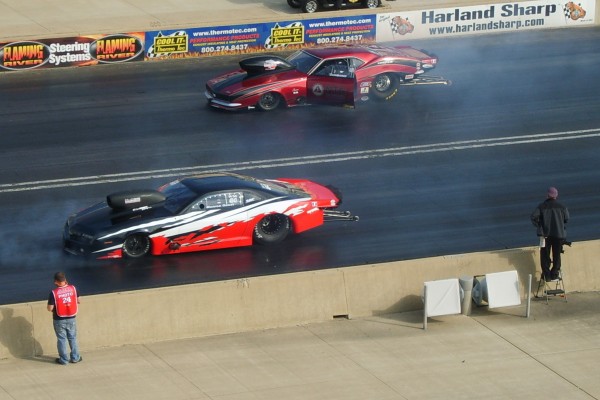 a pair of drag racers doing burnouts prior to a race
