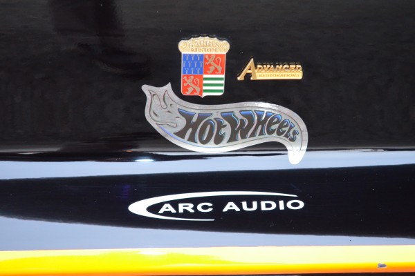 close up of hot wheels emblem on a car