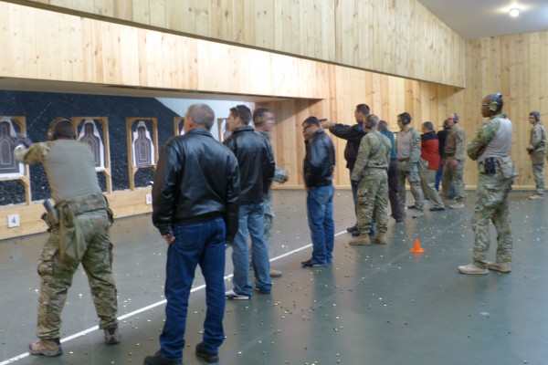 nhra drivers at shooting range with troops stationed overseas