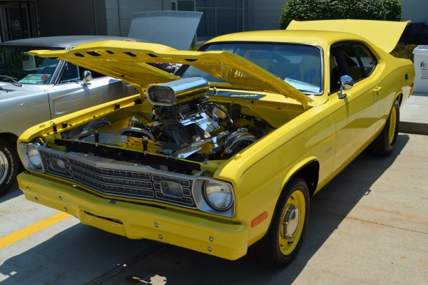 yellow Plymouth duster with hi-ram v8 and hood scoop