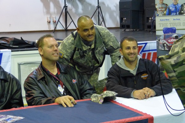 nhra drivers posing for pictures with troops stationed overseas