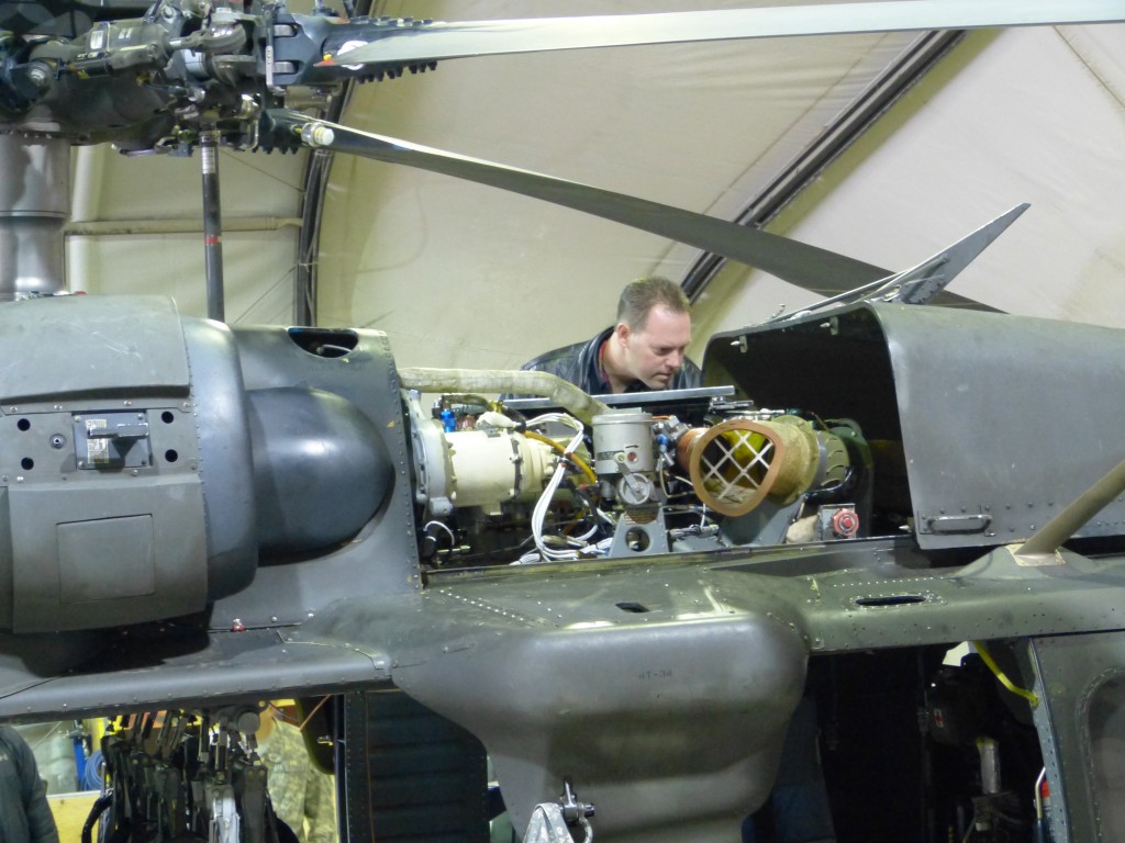 jason line nhra driver inspecting blackhawk helicopter engine