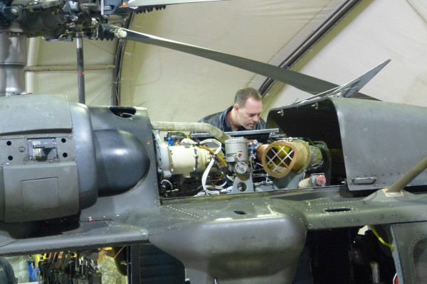 jason line nhra driver inspecting blackhawk helicopter engine