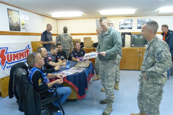 nhra drivers signing autographs for military troops overseas