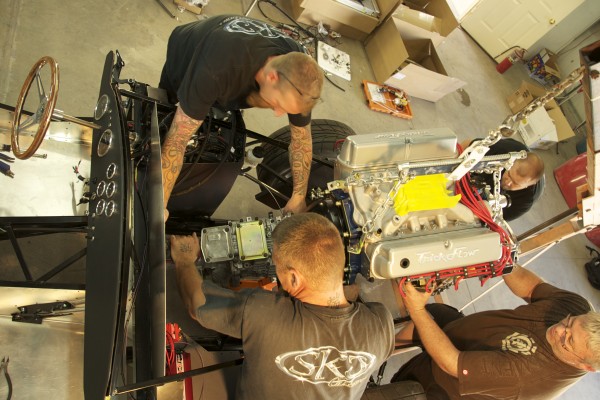 lowering an engine into a shelby cobra kit car