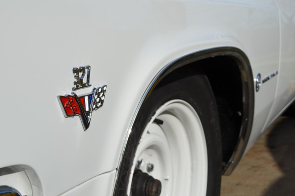 327 emblem fender badge on a 1965 chevy impala