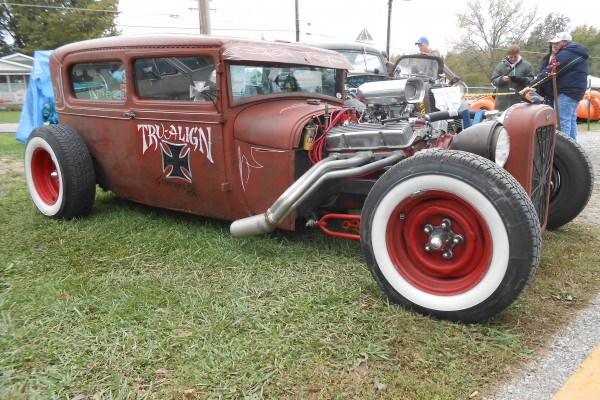 rat rod Tudor ford coupe parked on grass