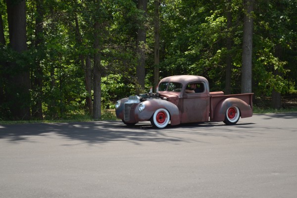 hot rod trucked parked near forest