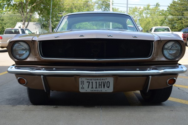 front bumper and headlight view of a 1965 ford mustang fastback