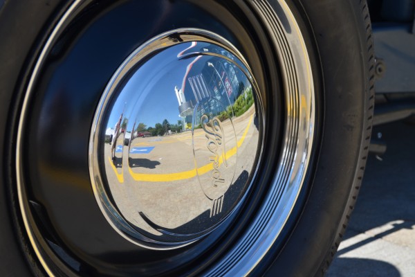 vintage ford chrome hubcap on a 1931 hot rod