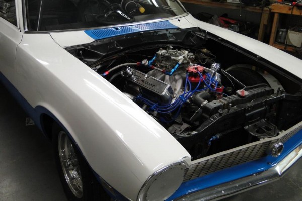 Ford Racing carbureted V8 engine in a vintage maverick