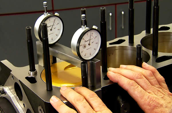 measuring piston travel with a dial gauge