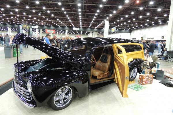 customized woody wagon hot rod at a car show