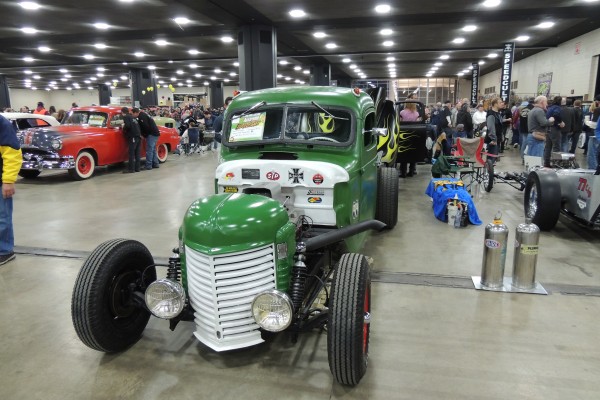 vintage hot rod truck at an indoor car show