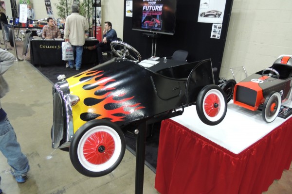 flamed hot rod pedal car on display at car show