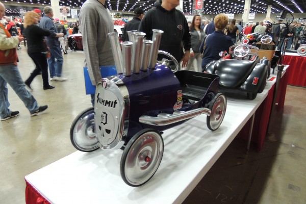 pedal cars on display at car show