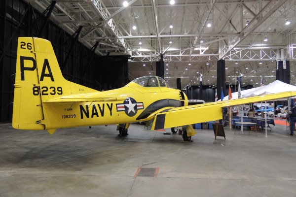 prop trainer aircraft in military display at car show