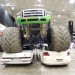 monster truck sitting atop crushed cars thumbnail