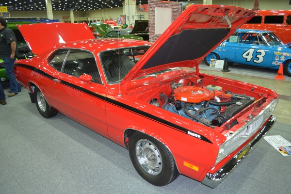 red plymouth duster 340 muscle car in a car show