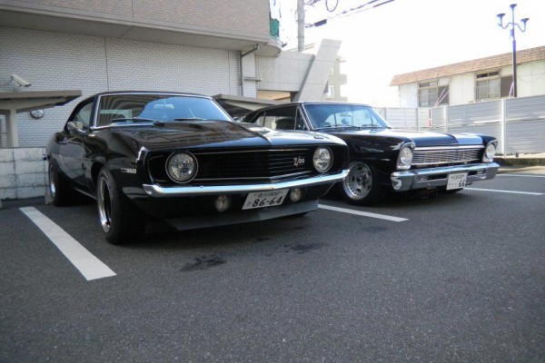 black 1969 chevy camaro and 1966 nova
